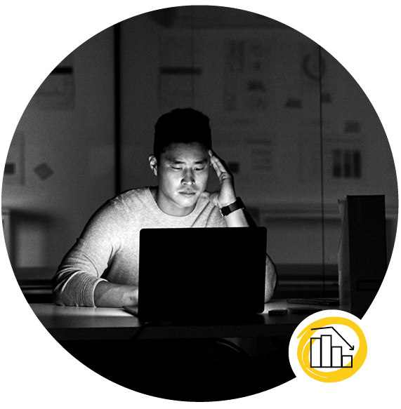 Home Problems 1 - a black and white photo of a man thinking while facing his laptop